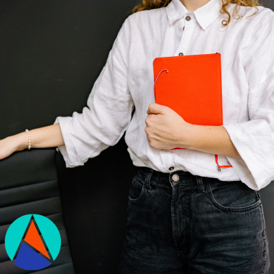 Woman holding a file with Aspire Recruiting's short logo